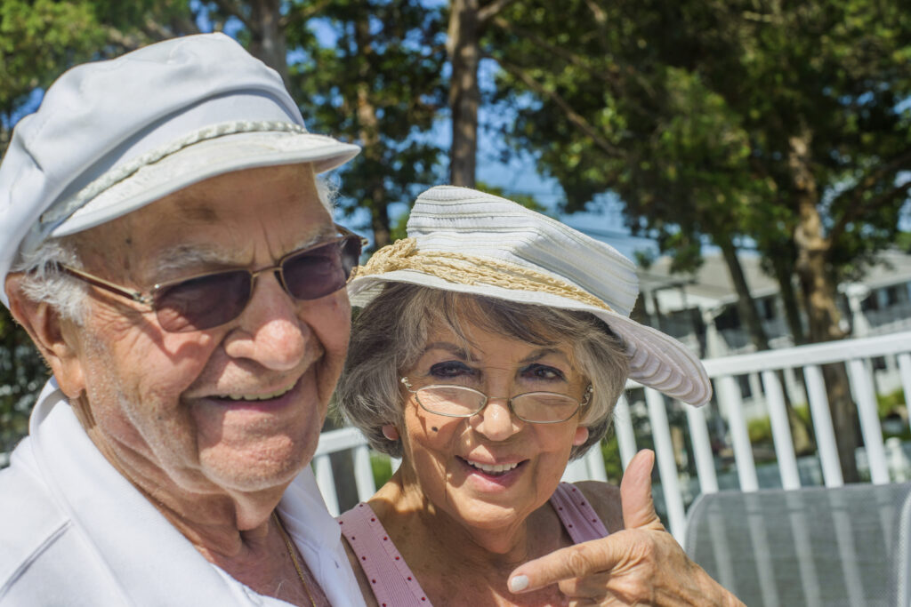 a man wearing a hat and sunglasses